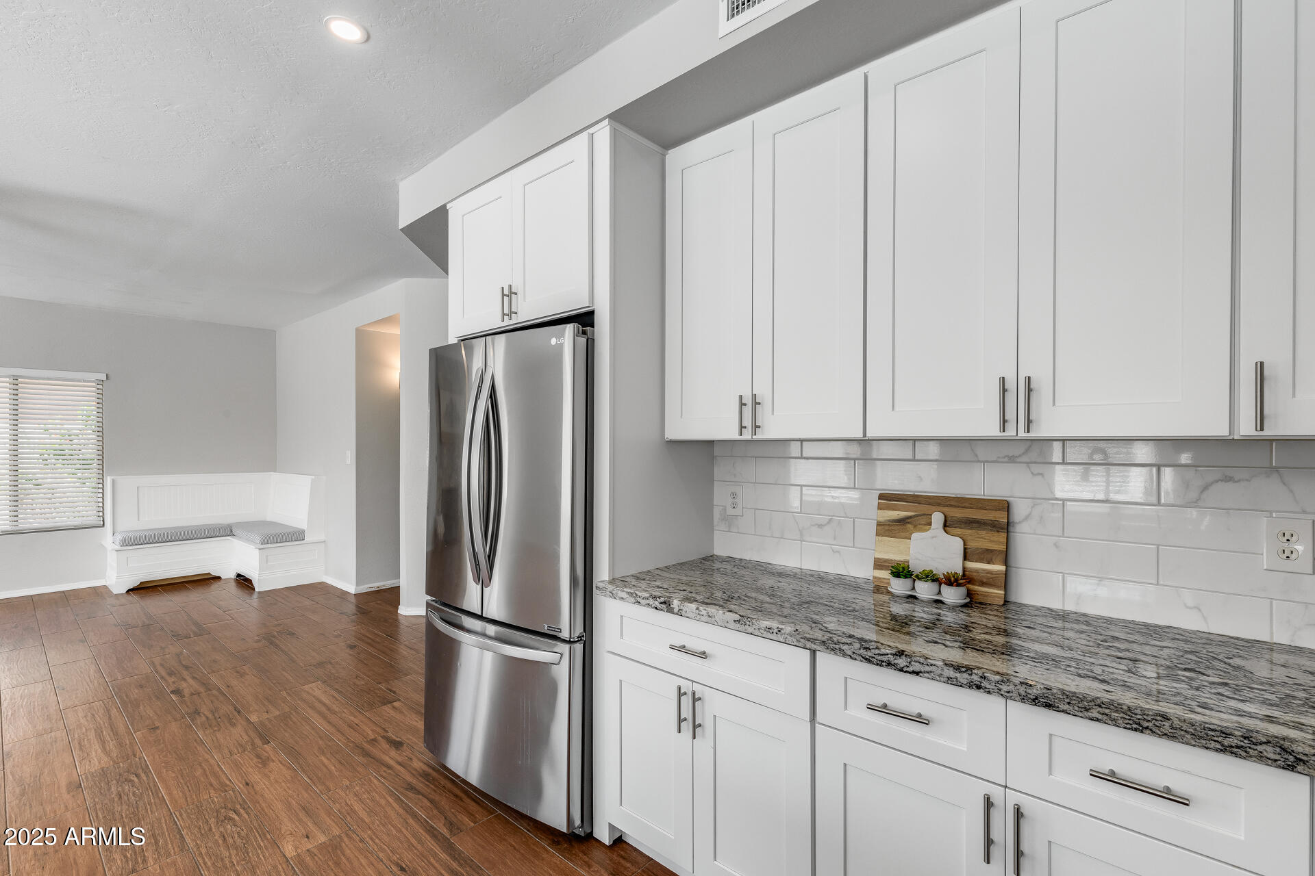 14452 South 40th Street Phoenix, AZ 85044 - Photo 36 of 92 a kitchen with granite countertop a refrigerator sink and cabinets