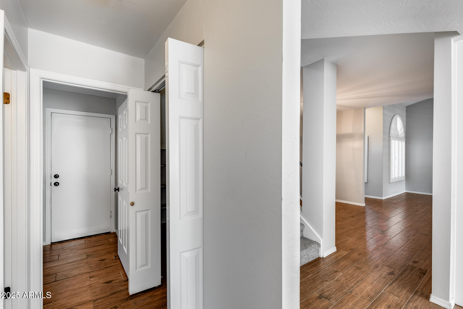 14452 South 40th Street Phoenix, AZ 85044 - Photo 37 of 92 a view of a hallway with wooden floor
