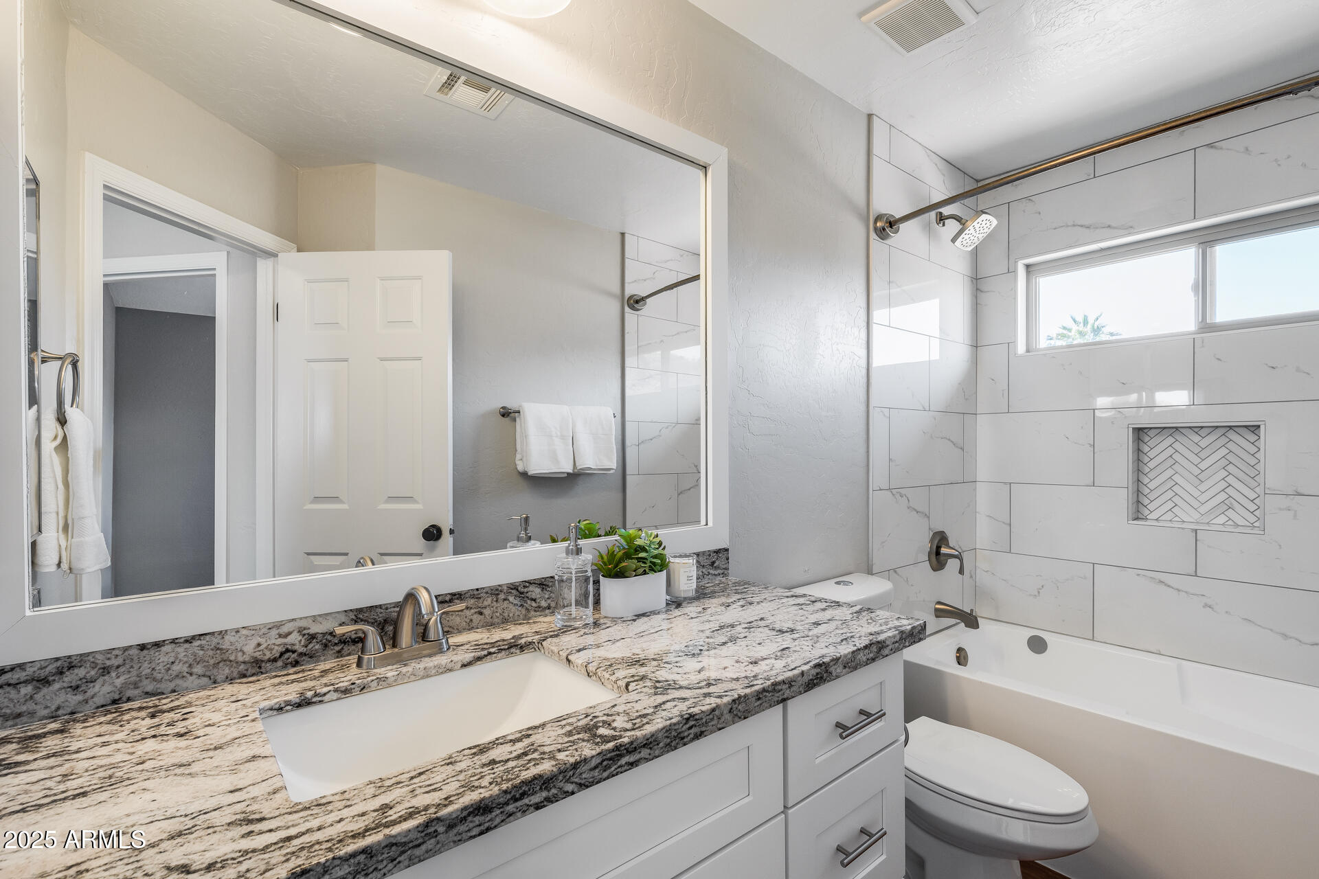 14452 South 40th Street Phoenix, AZ 85044 - Photo 48 of 92 a bathroom with a granite countertop sink toilet and shower