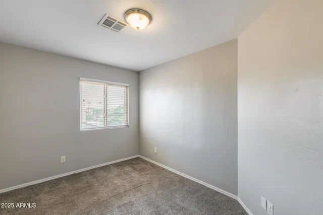 a view of a swimming pool with a yard