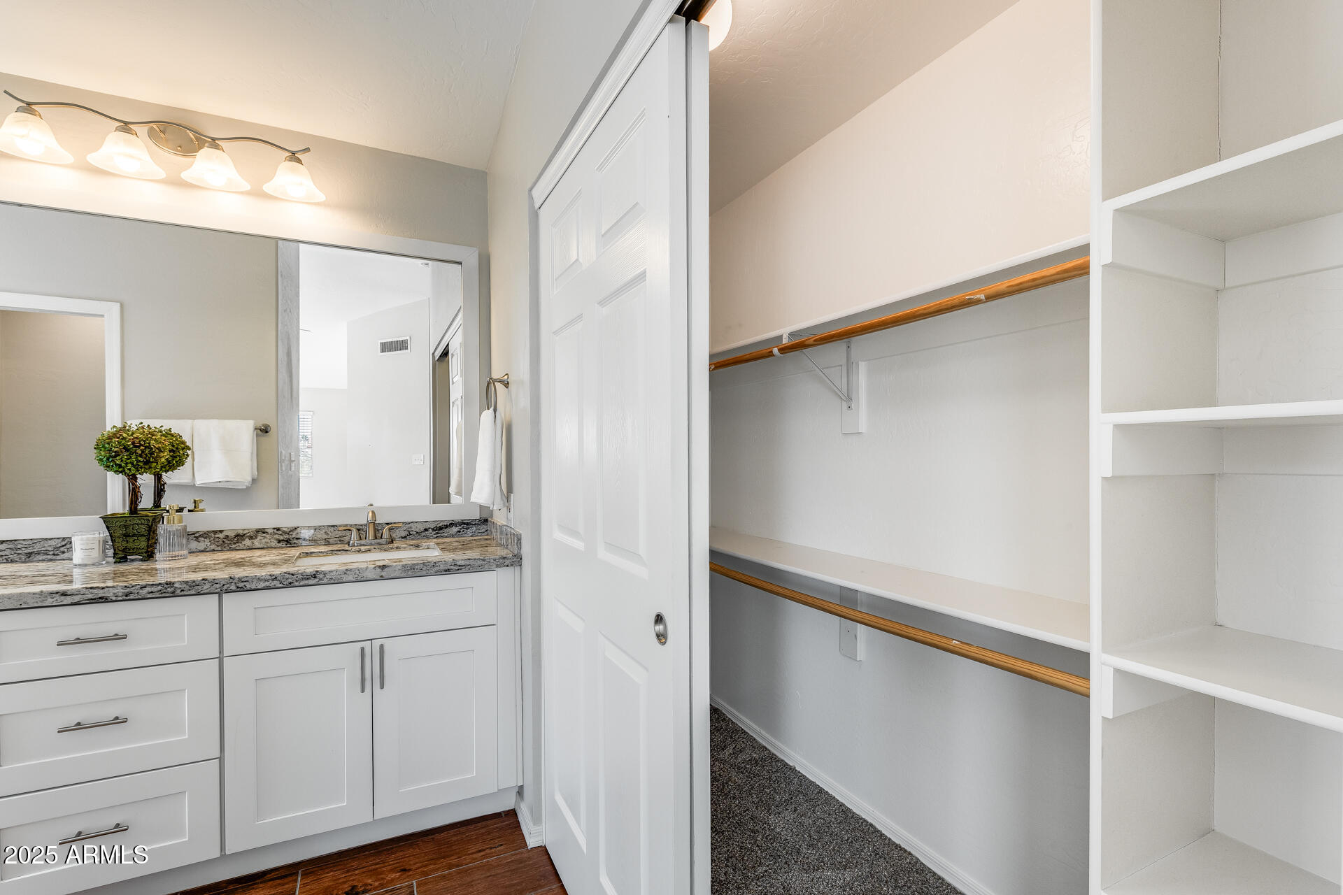 14452 South 40th Street Phoenix, AZ 85044 - Photo 56 of 92 a bathroom with a double vanity sink and mirror