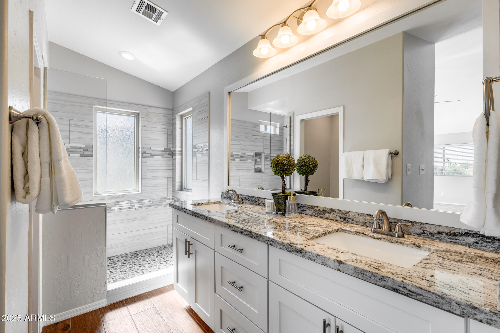 14452 South 40th Street Phoenix, AZ 85044 - Photo 57 of 92 a bathroom with a granite countertop sink and a mirror