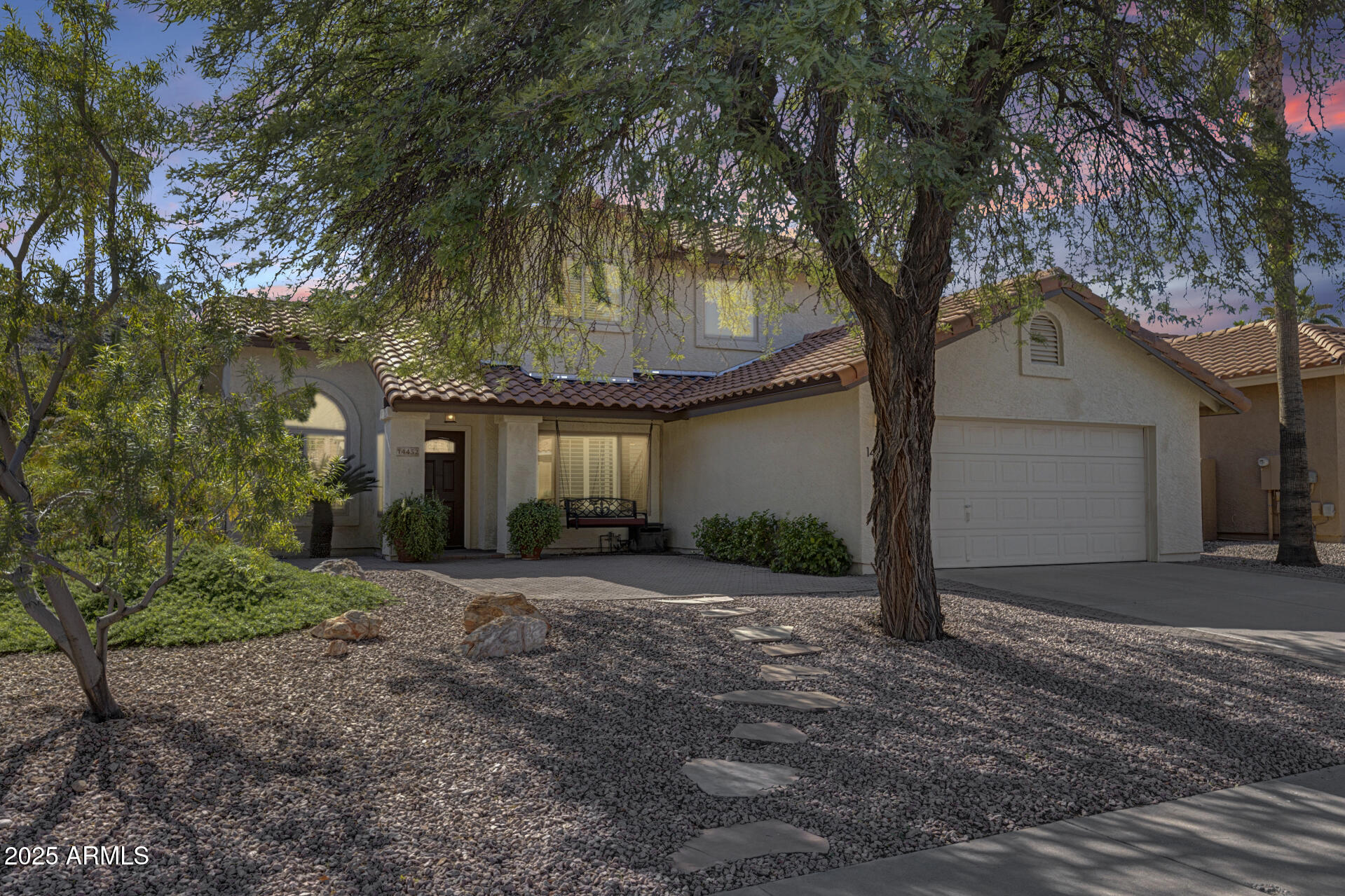 14452 South 40th Street Phoenix, AZ 85044 - Photo 76 of 92 a front view of a house with a yard and garage