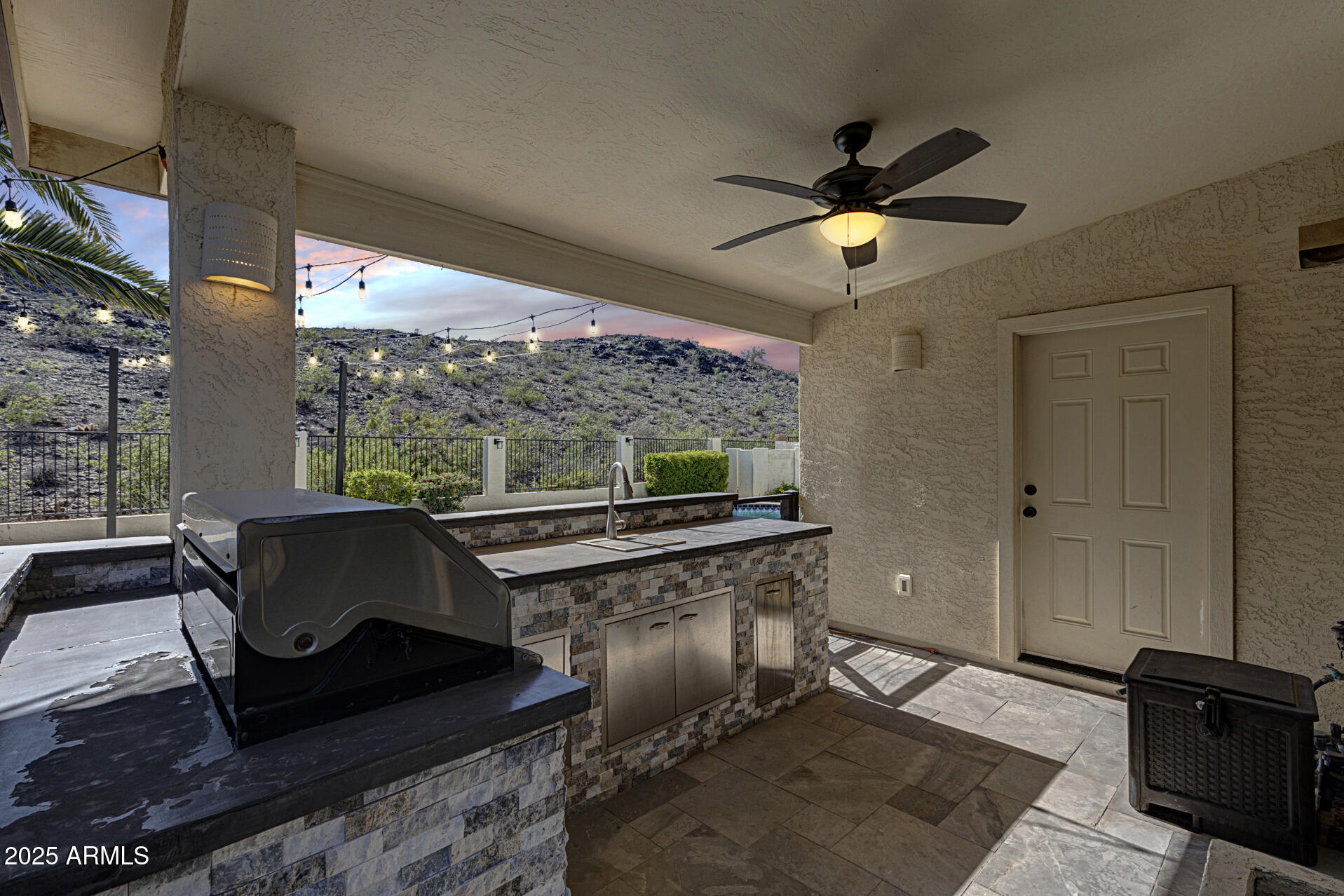 14452 South 40th Street Phoenix, AZ 85044 - Photo 91 of 92 a living room with couch and a ceiling fan