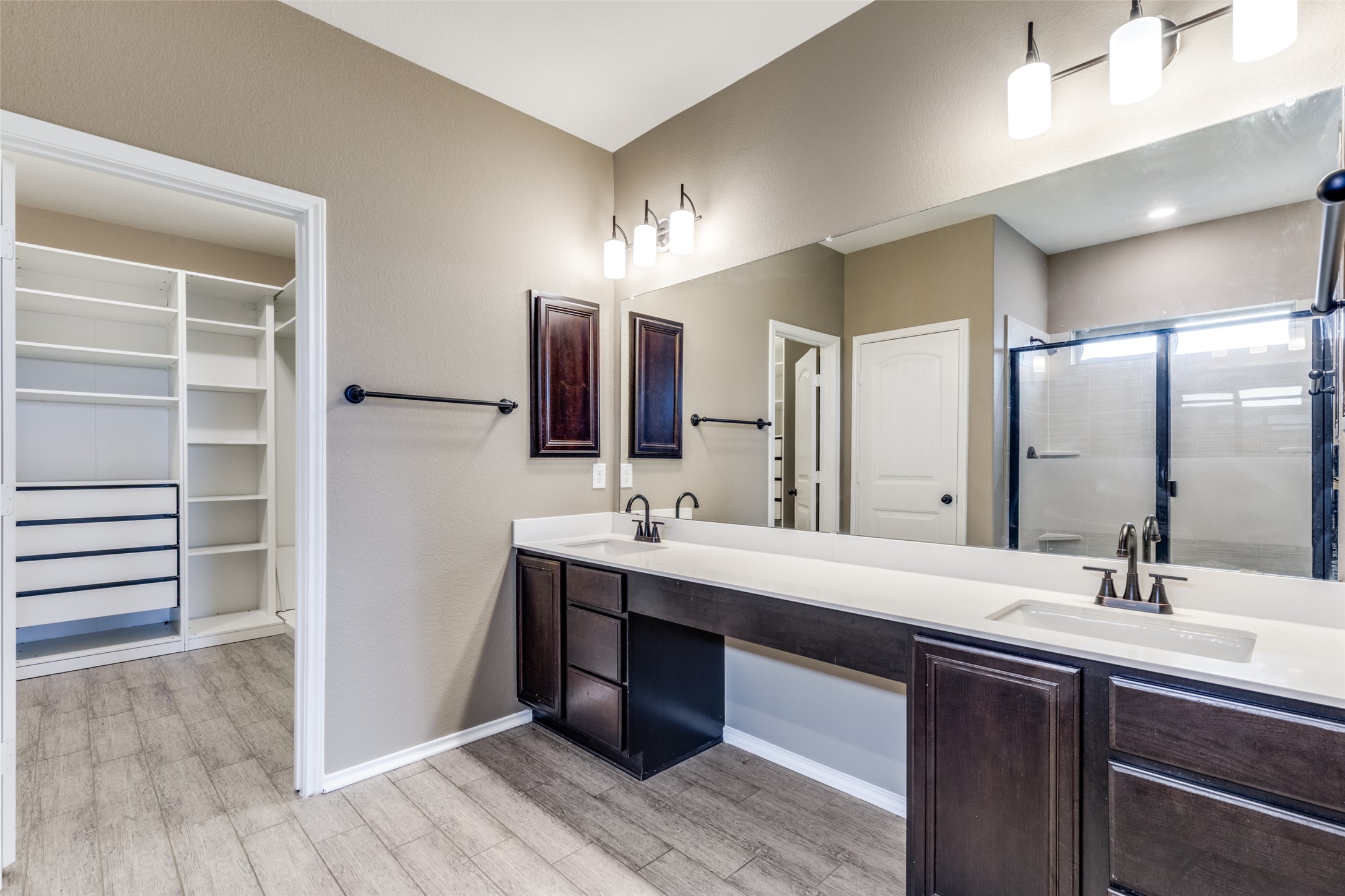 1205 Half Hitch Trail Georgetown, TX 78633 - Photo 11 of 12 a bathroom with a double vanity sink a mirror and a shower