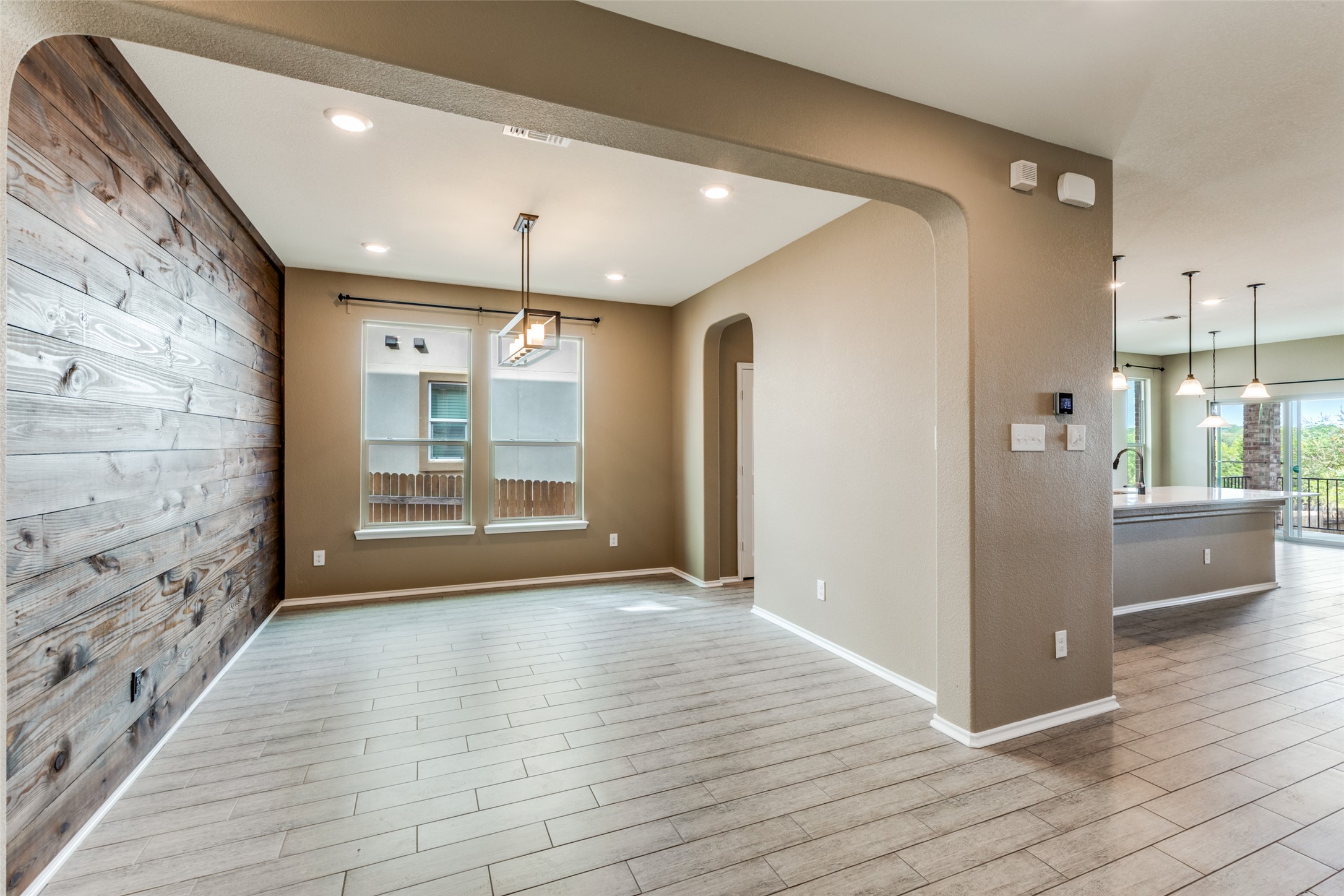 1205 Half Hitch Trail Georgetown, TX 78633 - Photo 3 of 12 a view of a hallway with wooden floor and a living room