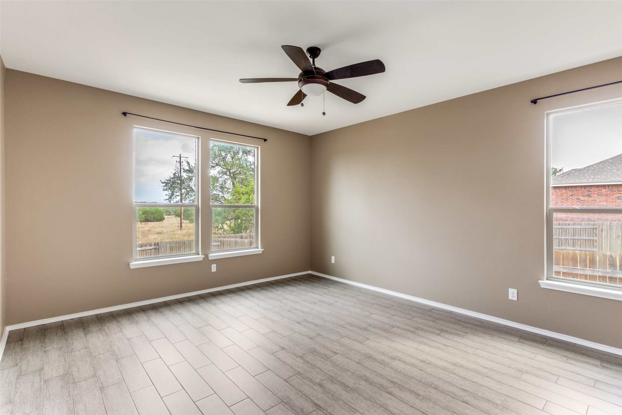 1205 Half Hitch Trail Georgetown, TX 78633 - Photo 5 of 12 wooden floor in an empty room with a window