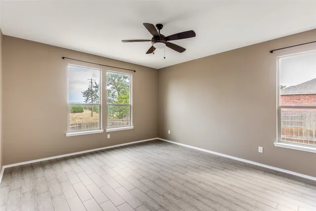 a kitchen with a stove a refrigerator a sink and chairs