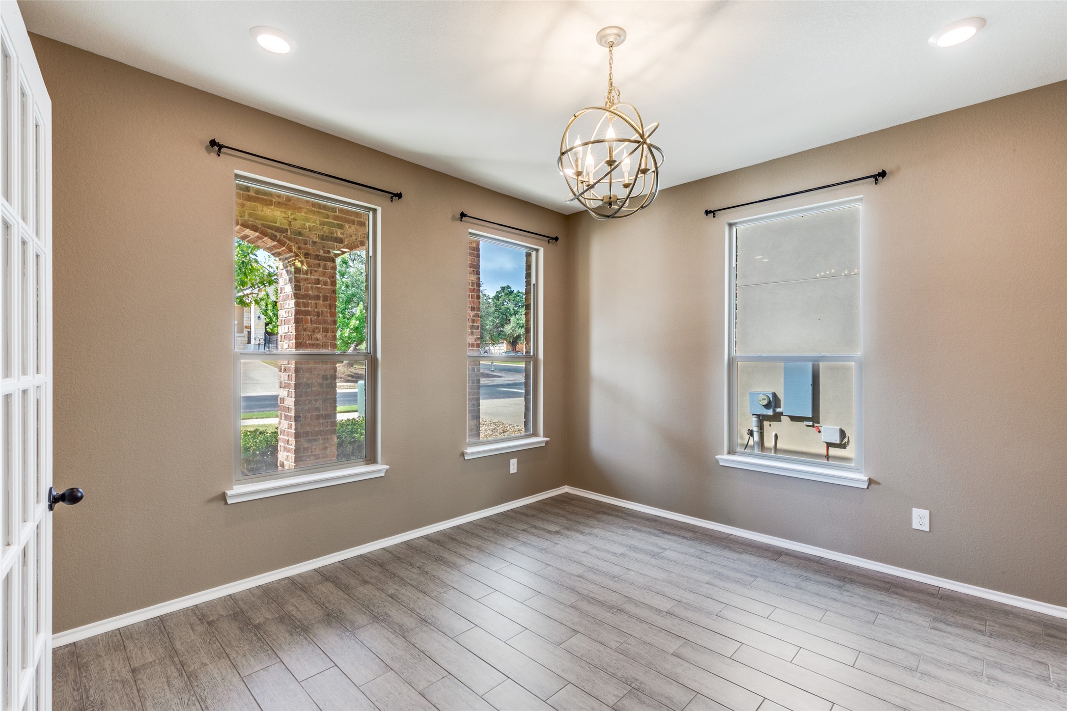 1205 Half Hitch Trail Georgetown, TX 78633 - Photo 6 of 12 wooden floor in an empty room with a window