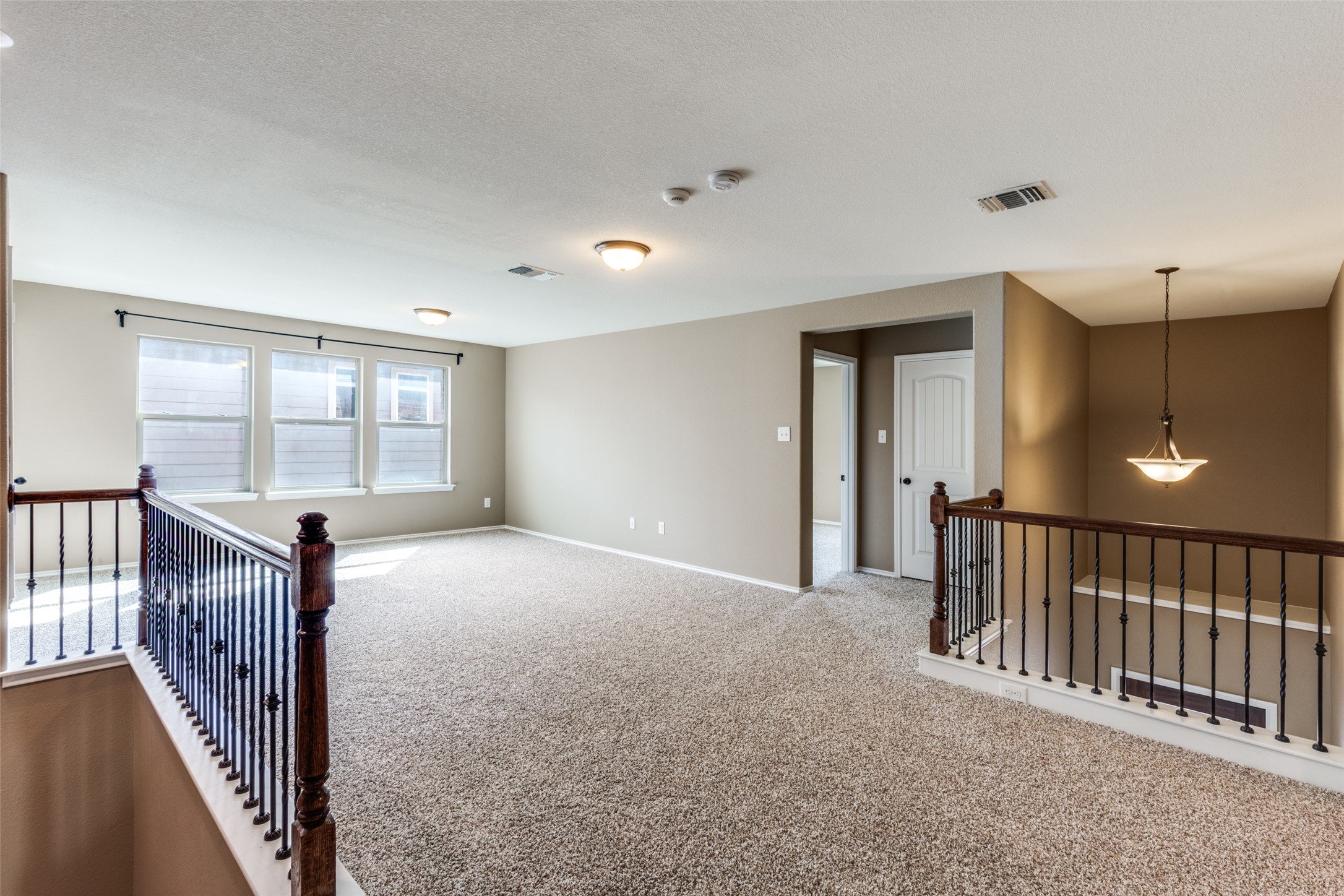 1205 Half Hitch Trail Georgetown, TX 78633 - Photo 7 of 12 a view of a hallway with windows and stairs
