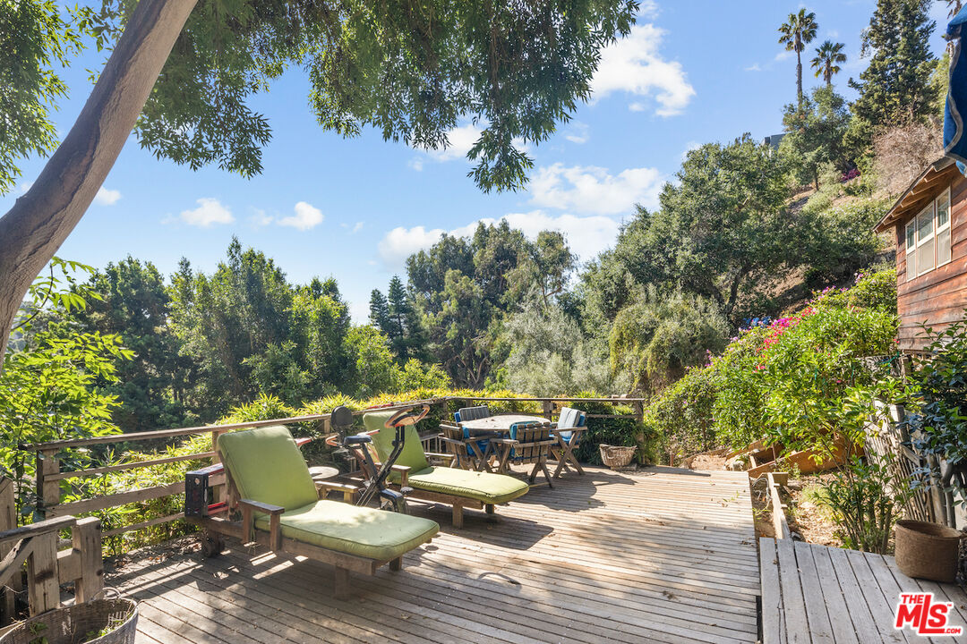 537 West Rustic Road Santa Monica, CA 90402 - Photo 14 of 22 a view of a patio with couches table and chairs and potted plants