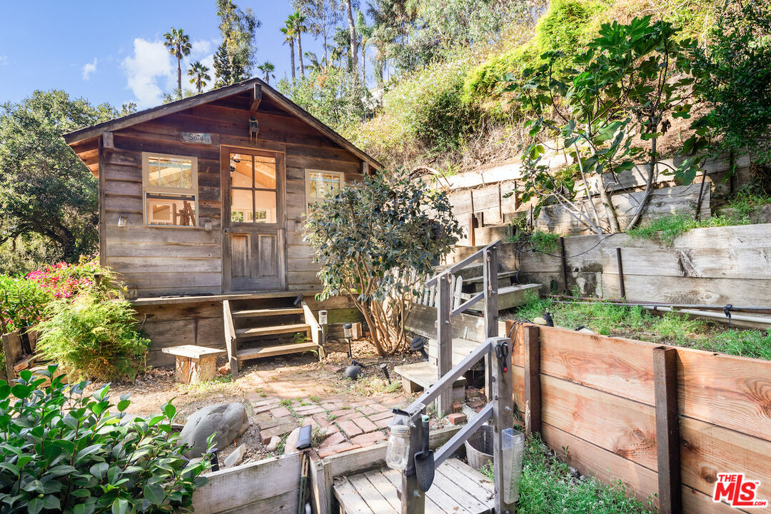 537 West Rustic Road Santa Monica, CA 90402 - Photo 15 of 22 a front view of a house with a yard