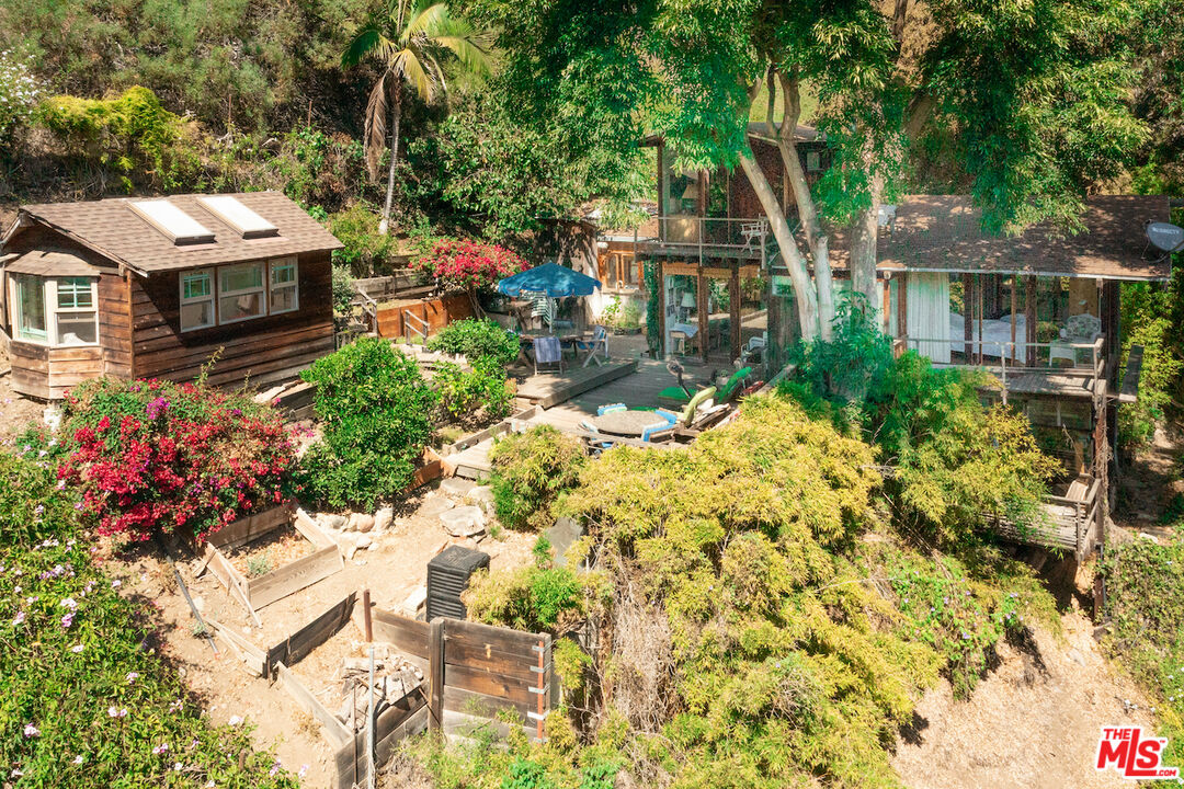 537 West Rustic Road Santa Monica, CA 90402 - Photo 19 of 22 a view of a house with a yard and garden