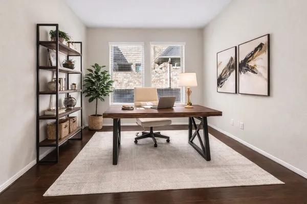 a workspace with furniture and window