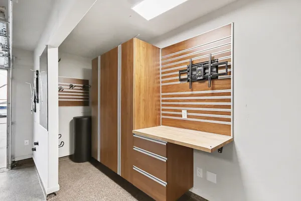 a kitchen with a refrigerator and washing machine