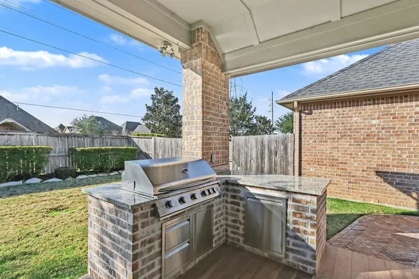 a view of a chairs and table in the patio
