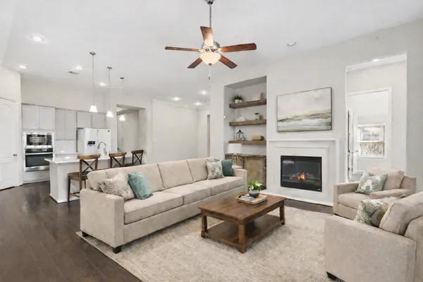 a living room with furniture and a fireplace