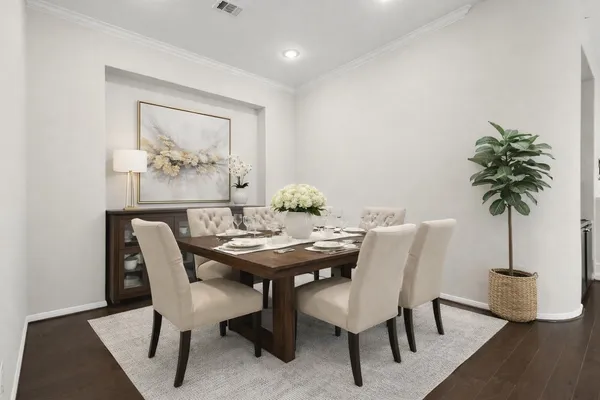 a view of a dining room with furniture and wooden floor