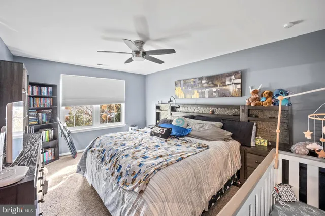 a bedroom with a bed furniture and a window