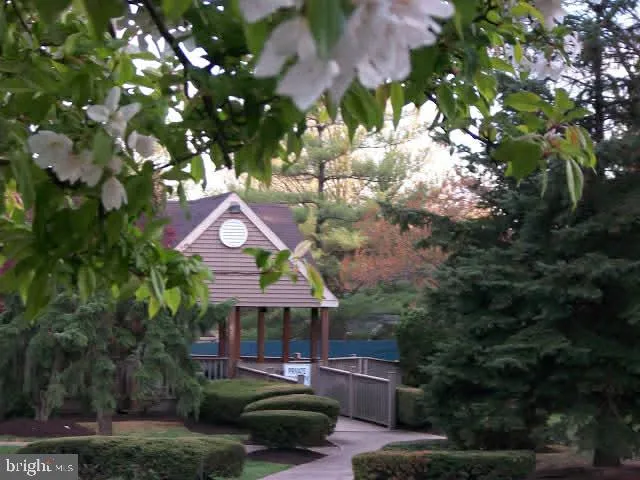 a view of a house with a backyard and a patio