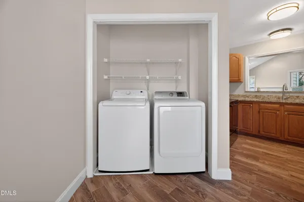 a view of a dining room with furniture and a window