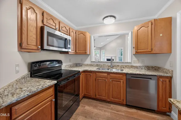 a kitchen with a stove and a microwave