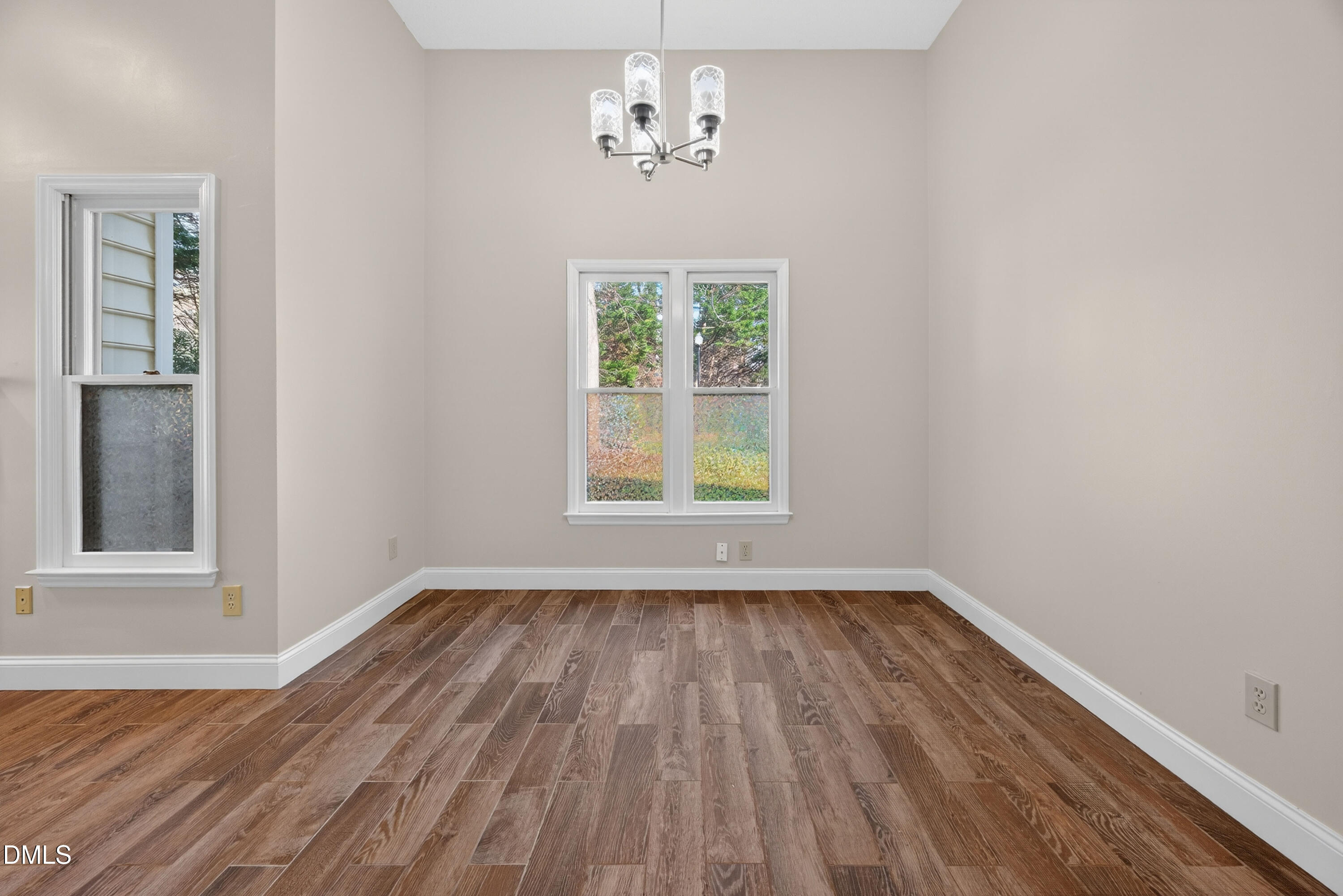 109 Linville River Road Cary, NC 27511 - Photo 15 of 41 wooden floor in an empty room with a window