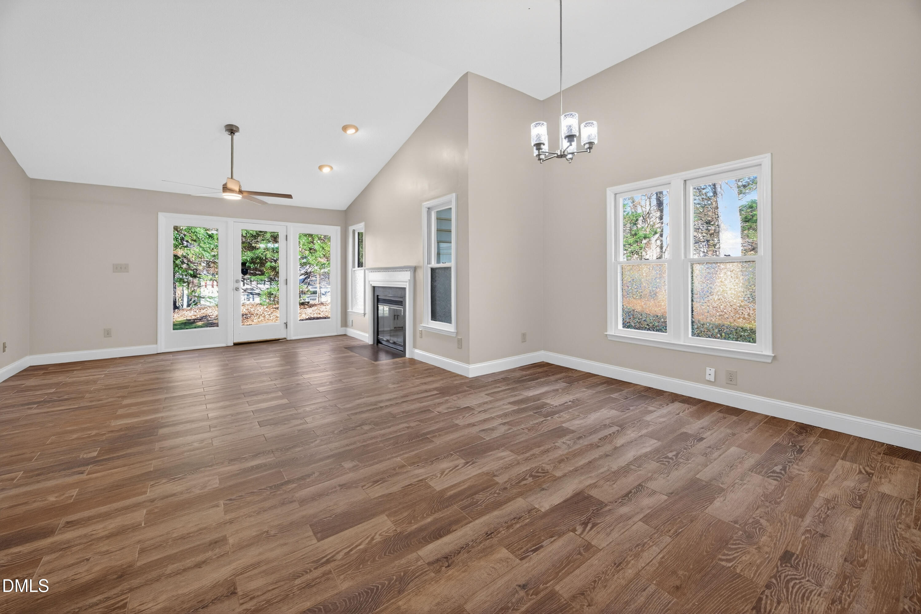 109 Linville River Road Cary, NC 27511 - Photo 16 of 41 a view of an empty room with wooden floor and a window