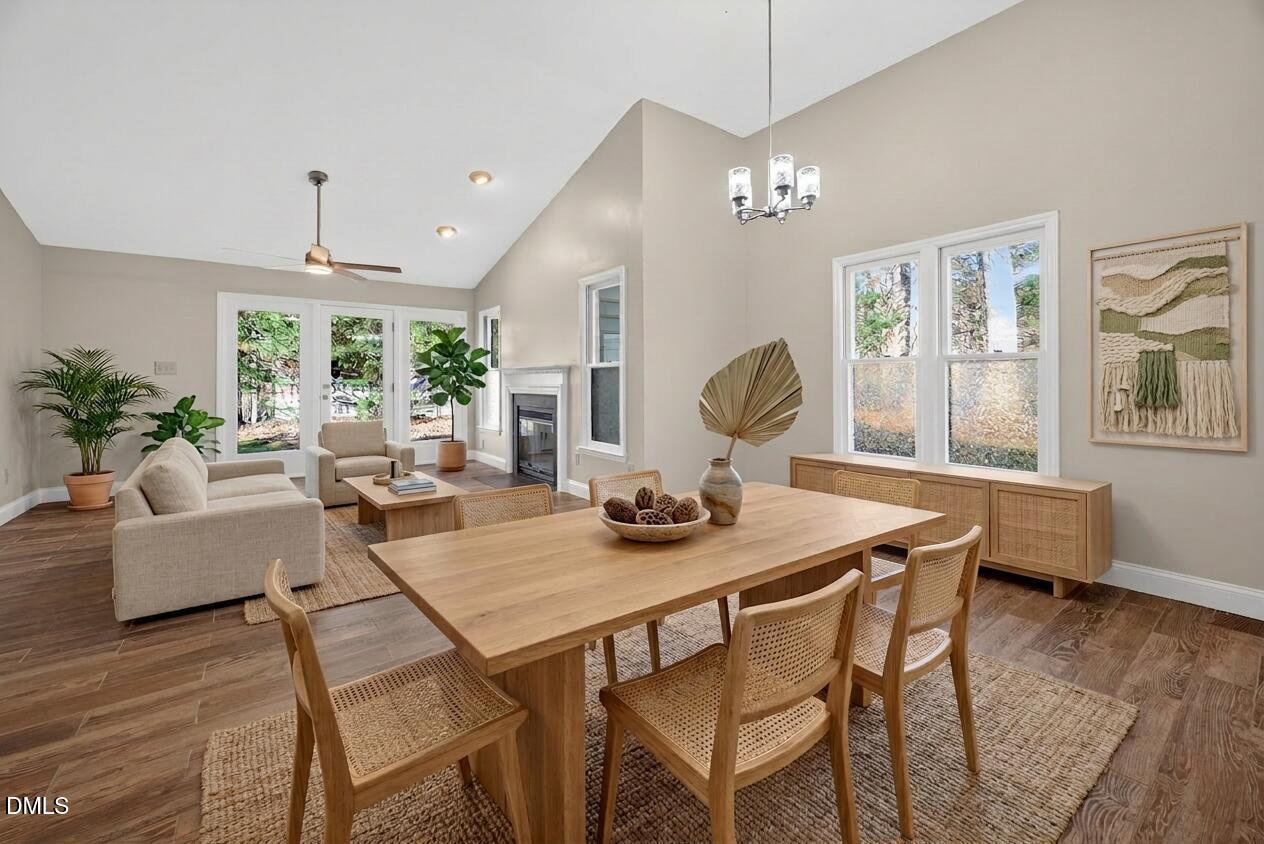 109 Linville River Road Cary, NC 27511 - Photo 17 of 41 a view of a dining room with furniture window and wooden floor