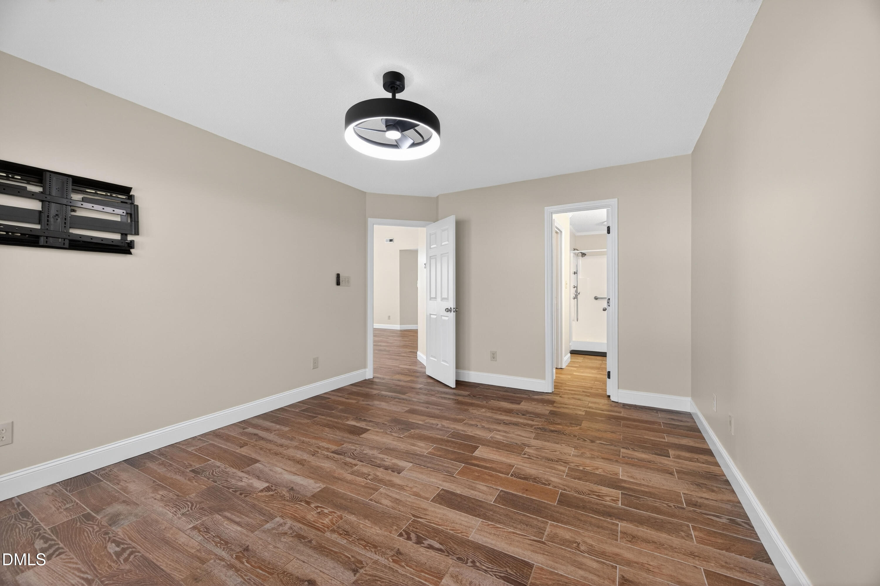 109 Linville River Road Cary, NC 27511 - Photo 21 of 41 a view of an empty room with wooden floor