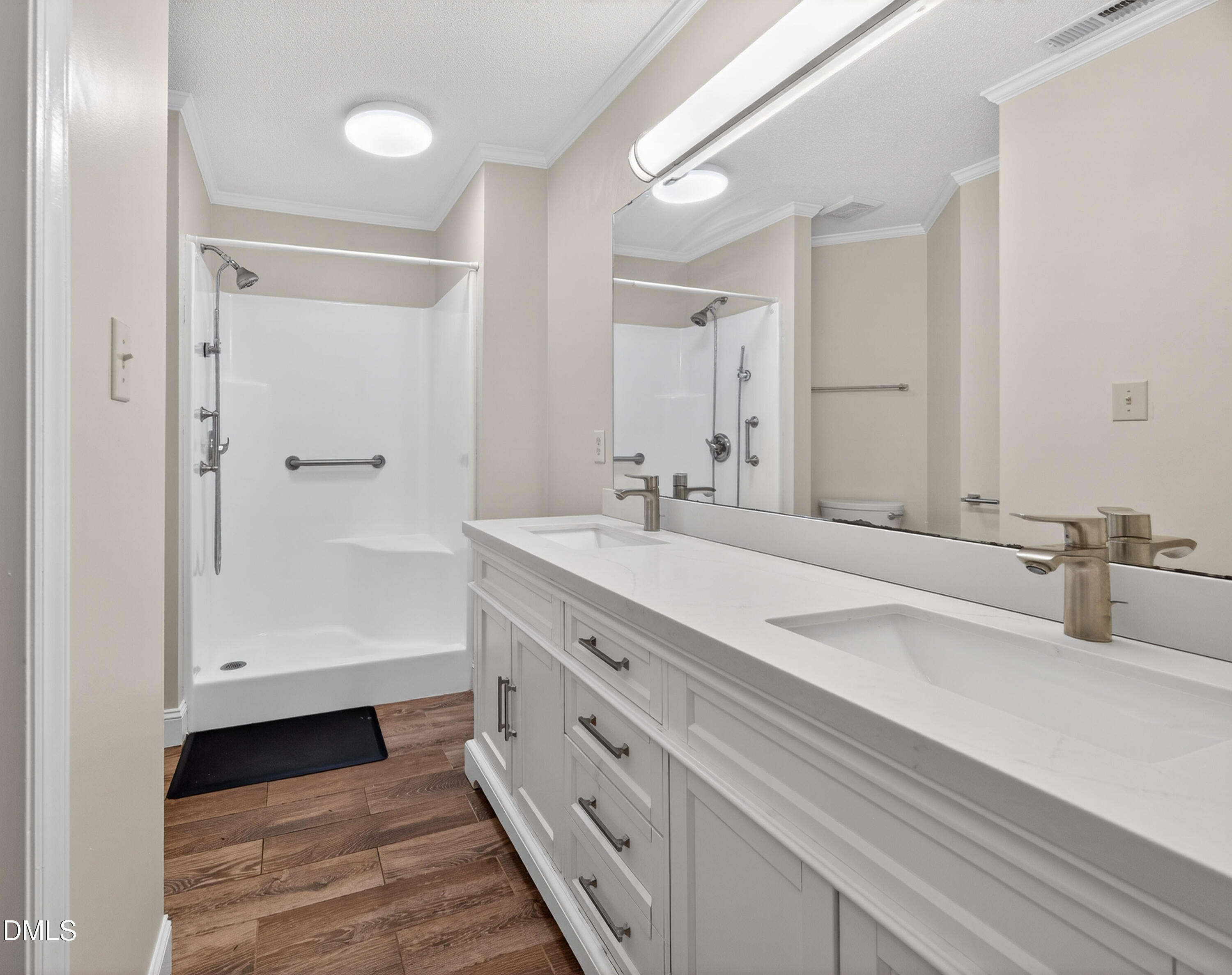 109 Linville River Road Cary, NC 27511 - Photo 24 of 41 a bathroom with double vanity and a mirror