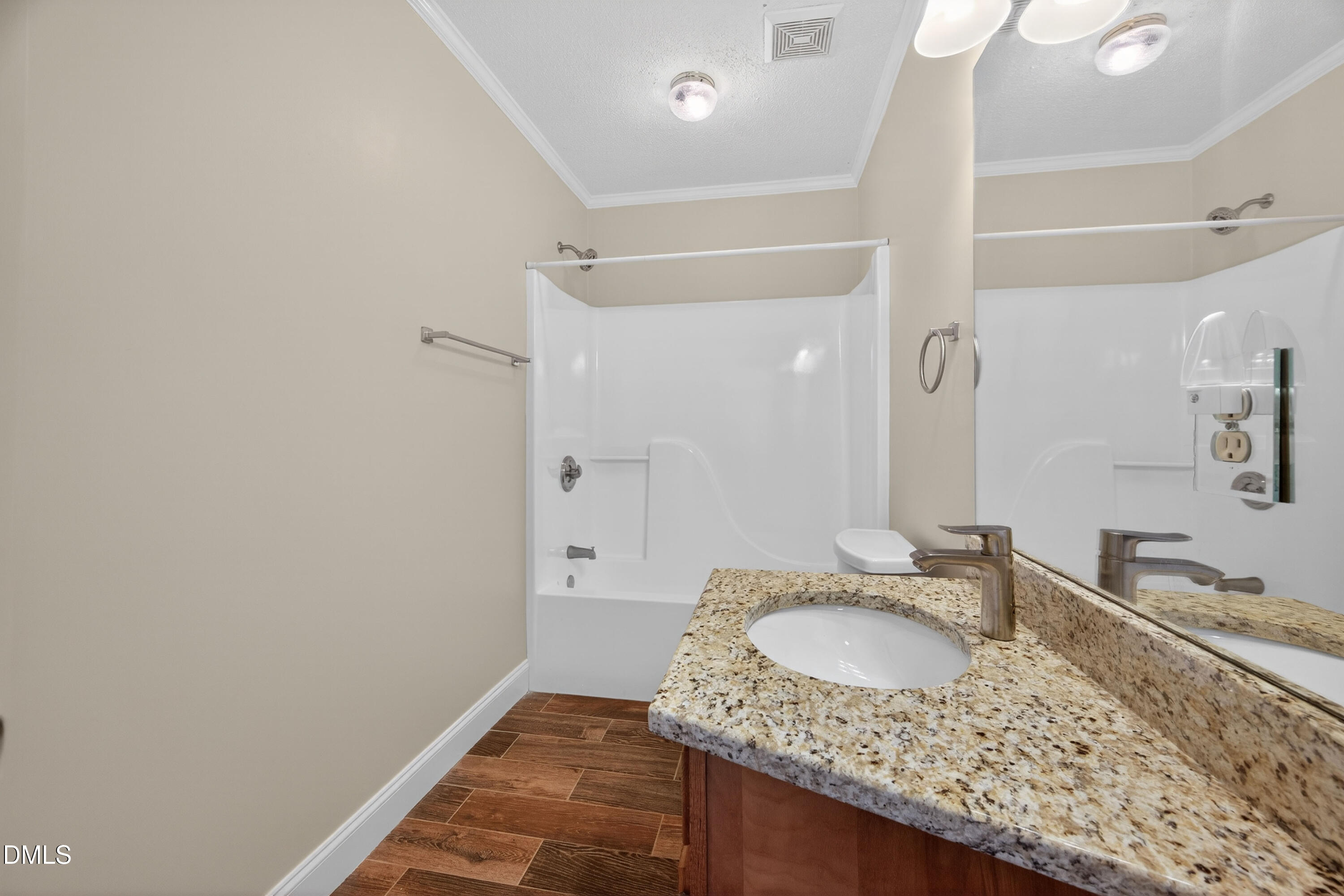 109 Linville River Road Cary, NC 27511 - Photo 30 of 41 a bathroom with a granite countertop sink a mirror and shower