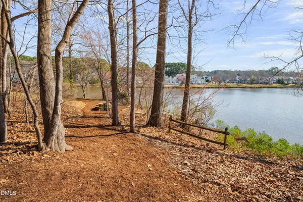 a view of a yard with brick wall