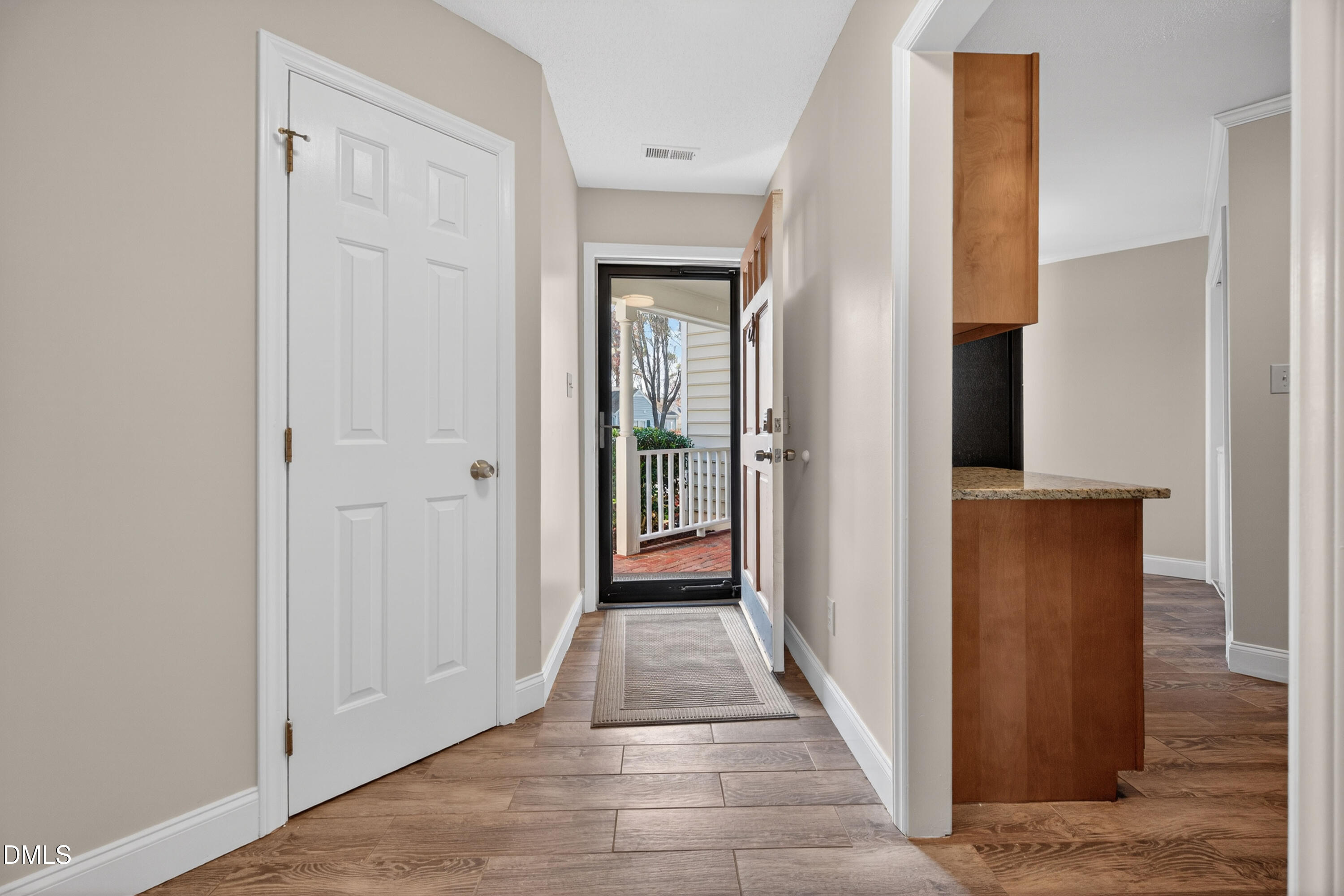 109 Linville River Road Cary, NC 27511 - Photo 6 of 41 a view of a hallway with wooden floor and closet