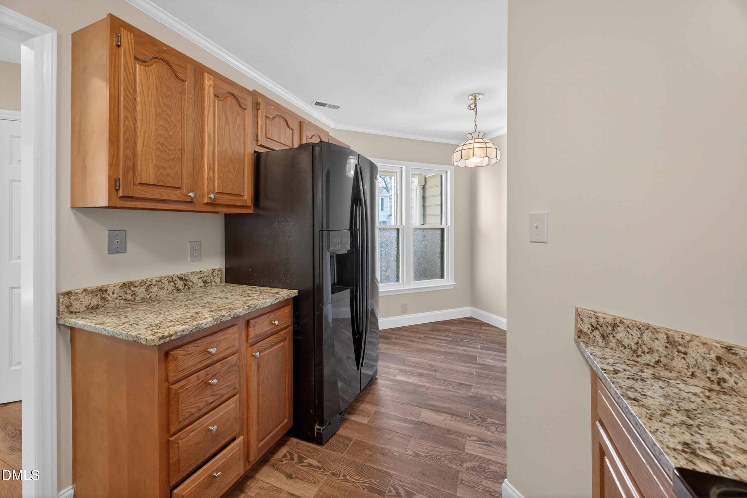 109 Linville River Road Cary, NC 27511 - Photo 7 of 41 a kitchen with stainless steel appliances granite countertop a refrigerator and a sink