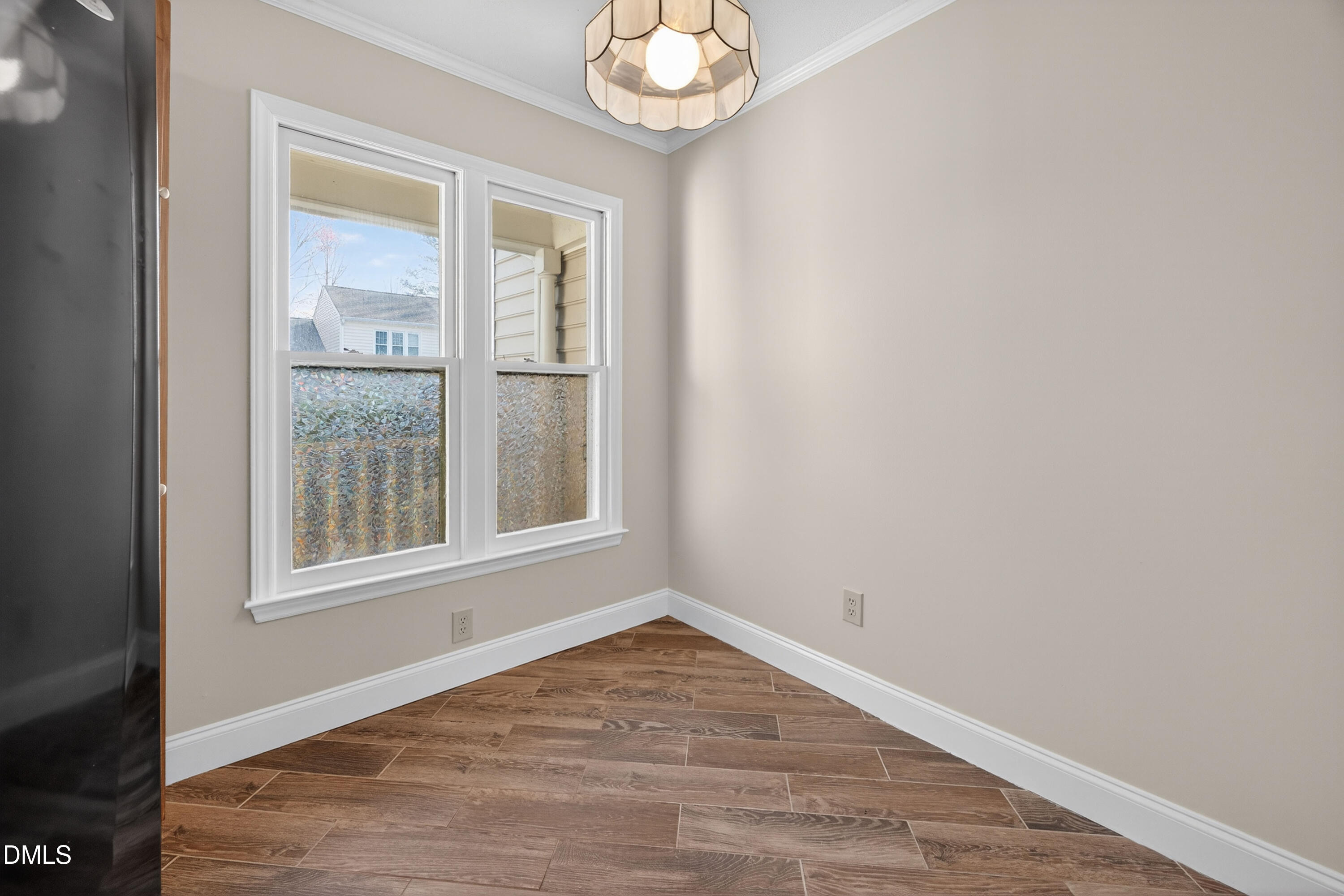 109 Linville River Road Cary, NC 27511 - Photo 8 of 41 an empty room with wooden floor and windows