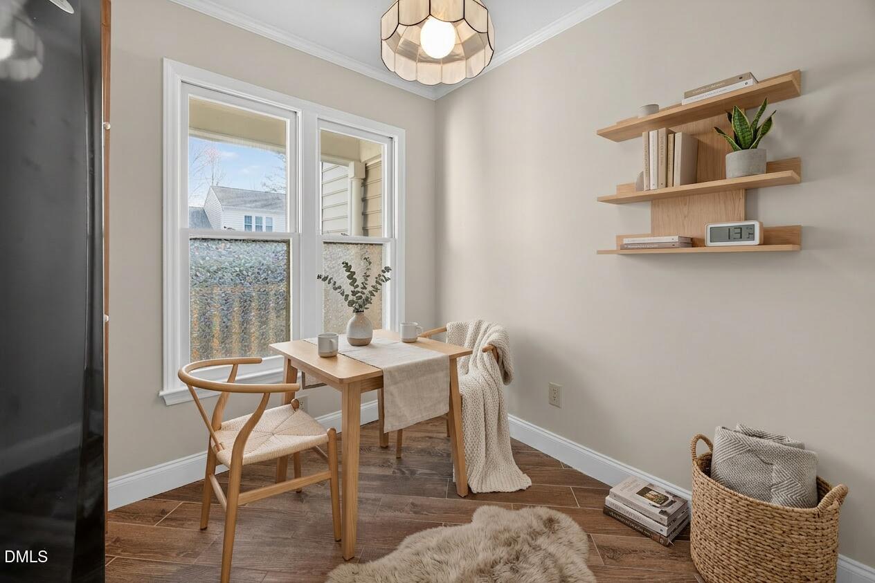 109 Linville River Road Cary, NC 27511 - Photo 9 of 41 a view of a dining room with furniture and a window