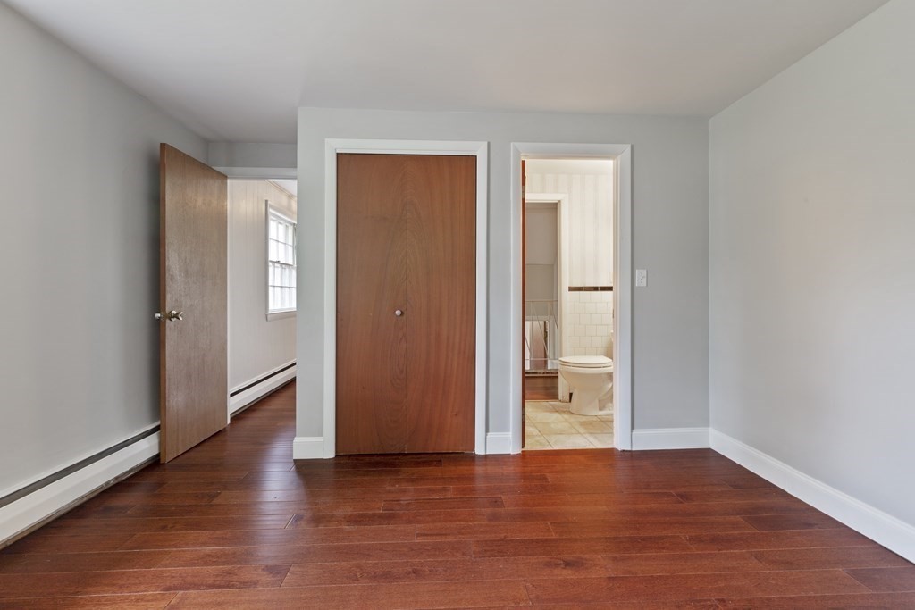 254 Edgell Road Framingham, MA 01701 - Photo 15 of 42 a view of an empty room with wooden floor and a window
