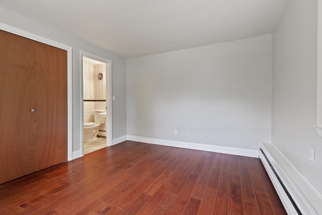 254 Edgell Road Framingham, MA 01701 - Photo 16 of 42 a view of wooden floor and windows in a room