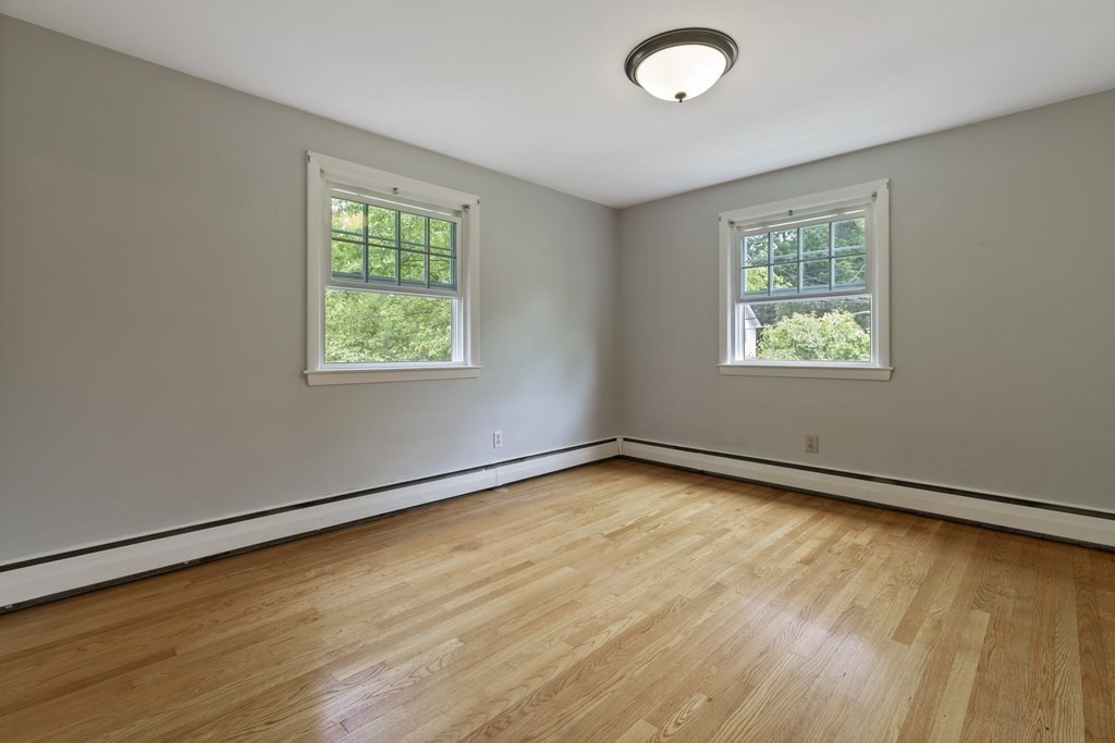 254 Edgell Road Framingham, MA 01701 - Photo 20 of 42 a view of a room with wooden floor and windows