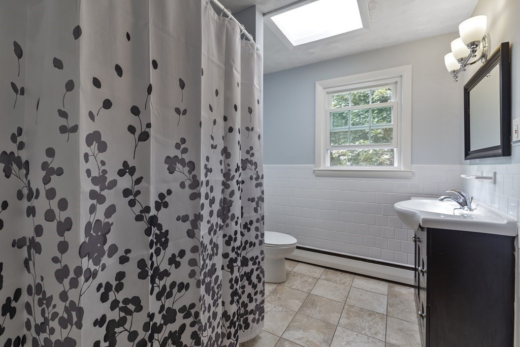 254 Edgell Road Framingham, MA 01701 - Photo 24 of 42 a bathroom with a sink and a mirror
