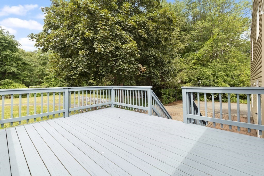 254 Edgell Road Framingham, MA 01701 - Photo 28 of 42 a view of balcony with wooden floor and fence
