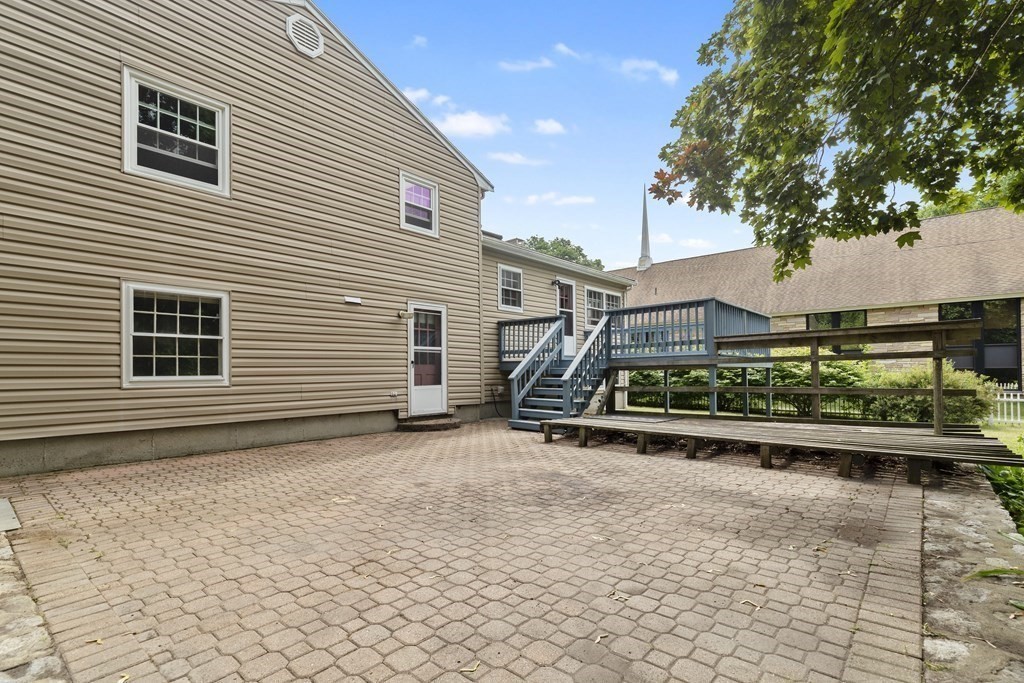 254 Edgell Road Framingham, MA 01701 - Photo 29 of 42 a view of a house with backyard and sitting area