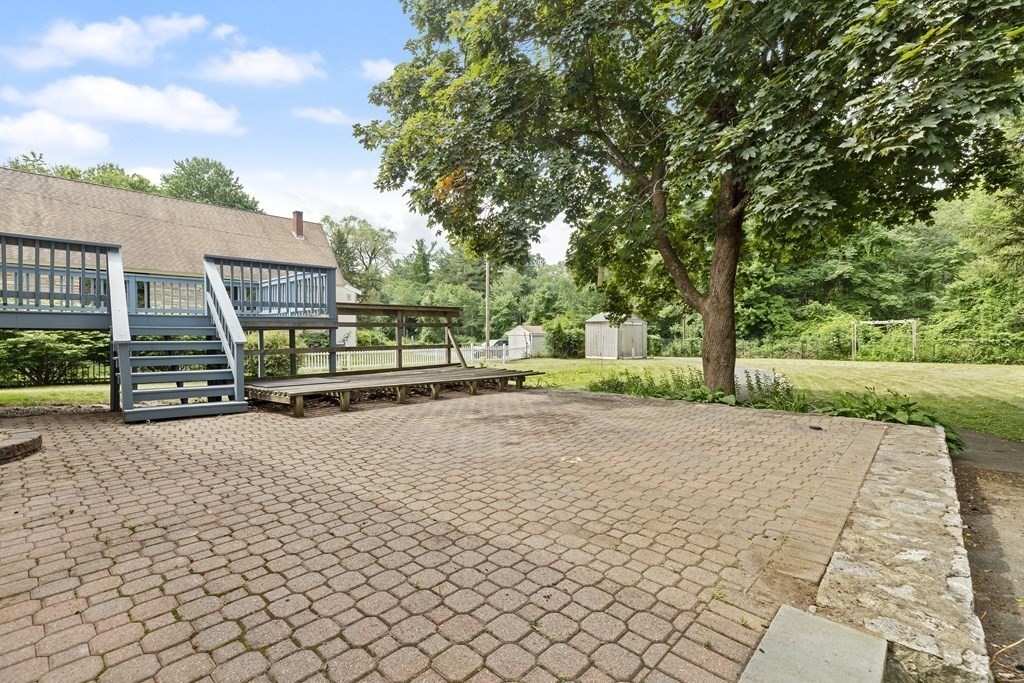 254 Edgell Road Framingham, MA 01701 - Photo 30 of 42 a view of a house with backyard and a tree