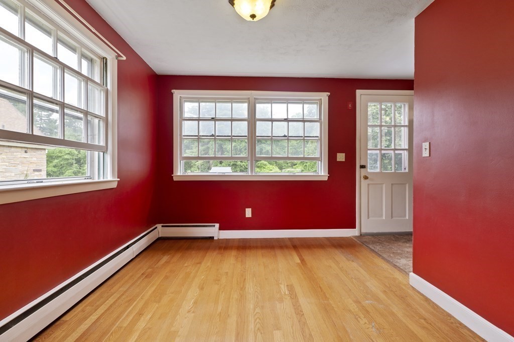 254 Edgell Road Framingham, MA 01701 - Photo 7 of 42 a view of empty room with wooden floor and fan