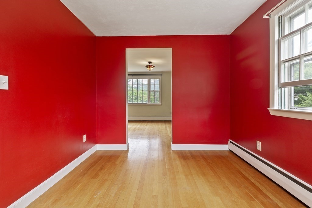 254 Edgell Road Framingham, MA 01701 - Photo 8 of 42 a view of empty room with wooden floor and fan
