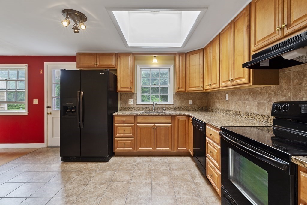 254 Edgell Road Framingham, MA 01701 - Photo 10 of 42 a kitchen with a refrigerator and a sink