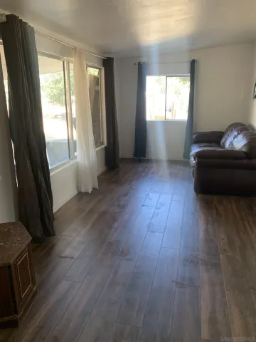 a backyard of a house with lots of green space and trees