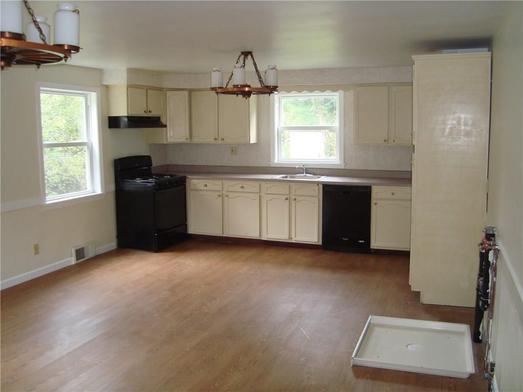 715 New Texas Road Plum, PA 15239 - Photo 5 of 15 Kitchen with laundry