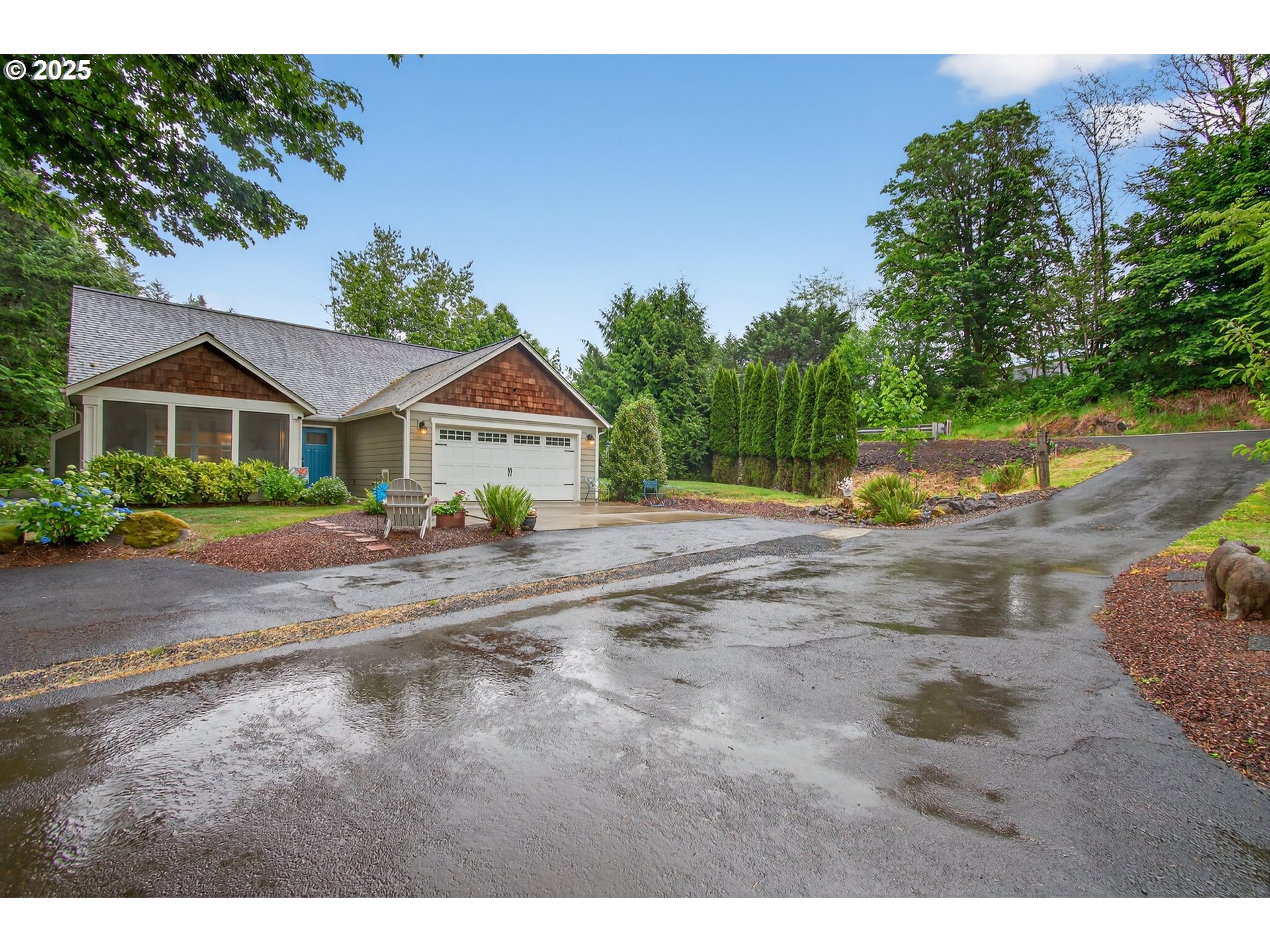 721 Abernathy Creek Road Longview, WA 98632 - Photo 3 of 40 a view of house with yard and trees in the background